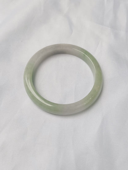 GUARDIAN | JAYDE Untreated Grade-A Jadeite Bangle in Pastel Green and Light Purple undertone (56.5mm Half Round)