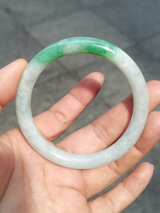 GUARDIAN | JAYDE Untreated Grade-A Jadeite Bangle in Dreamy White with patches of Vibrant Green (55.3mm Round)
