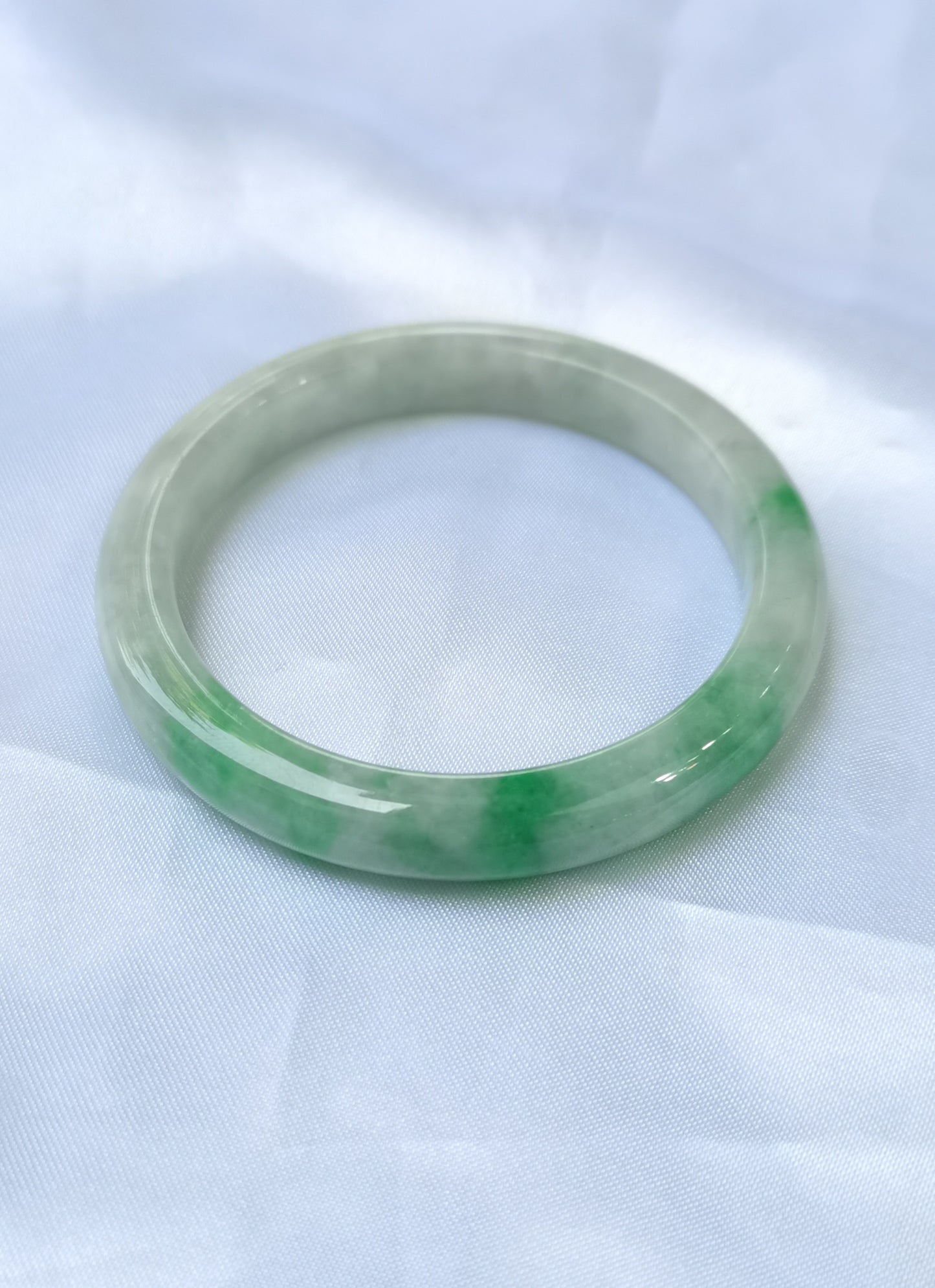 GUARDIAN | JAYDE Untreated Grade-A Jadeite Bangle in Dreamy White with patches of Vibrant Green (52.2mm Round)