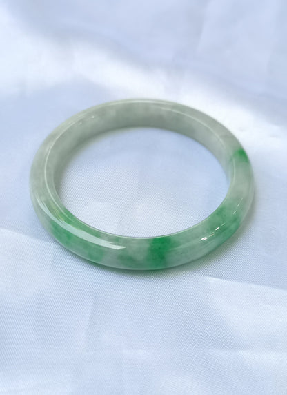 GUARDIAN | JAYDE Untreated Grade-A Jadeite Bangle in Dreamy White with patches of Vibrant Green (52.2mm Round)