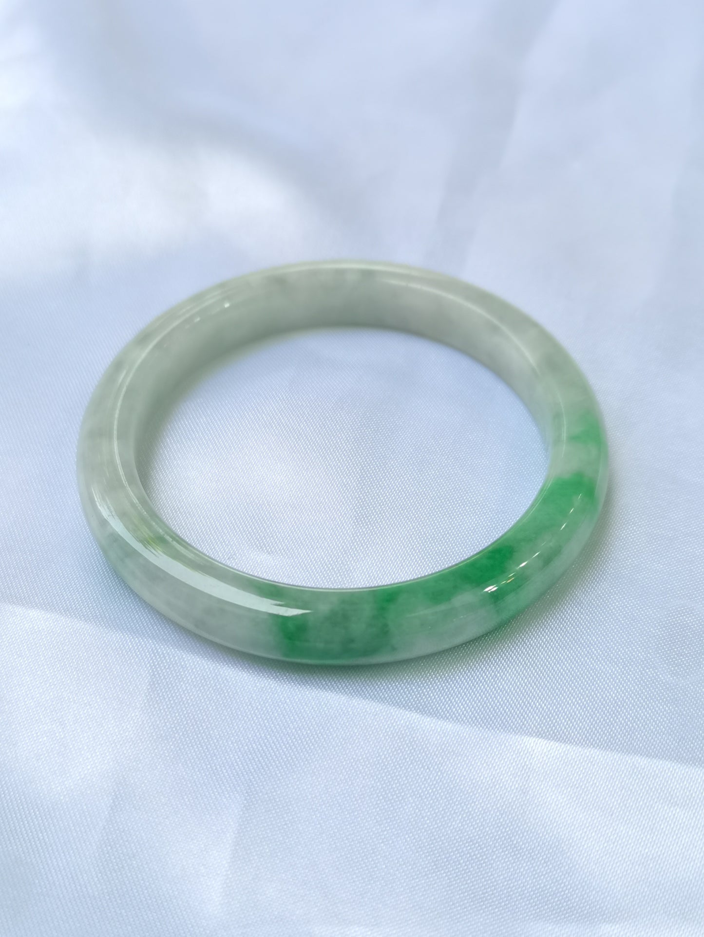 GUARDIAN | JAYDE Untreated Grade-A Jadeite Bangle in Dreamy White with patches of Vibrant Green (52.2mm Round)