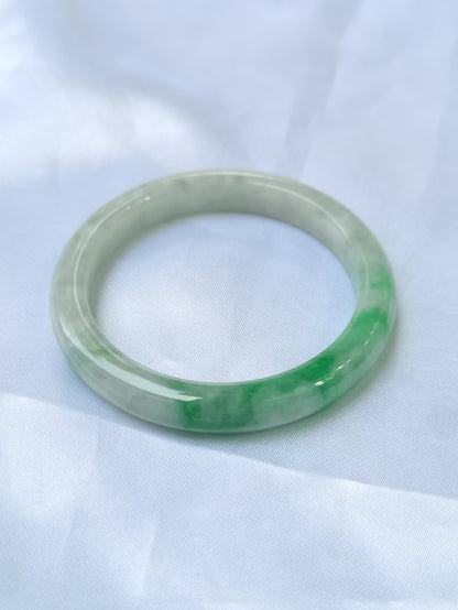 GUARDIAN | JAYDE Untreated Grade-A Jadeite Bangle in Dreamy White with patches of Vibrant Green (52.2mm Round)