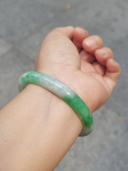 GUARDIAN | JAYDE Untreated Grade-A Jadeite Bangle in Dreamy White with patches of Vibrant Green (56.1mm Oval)