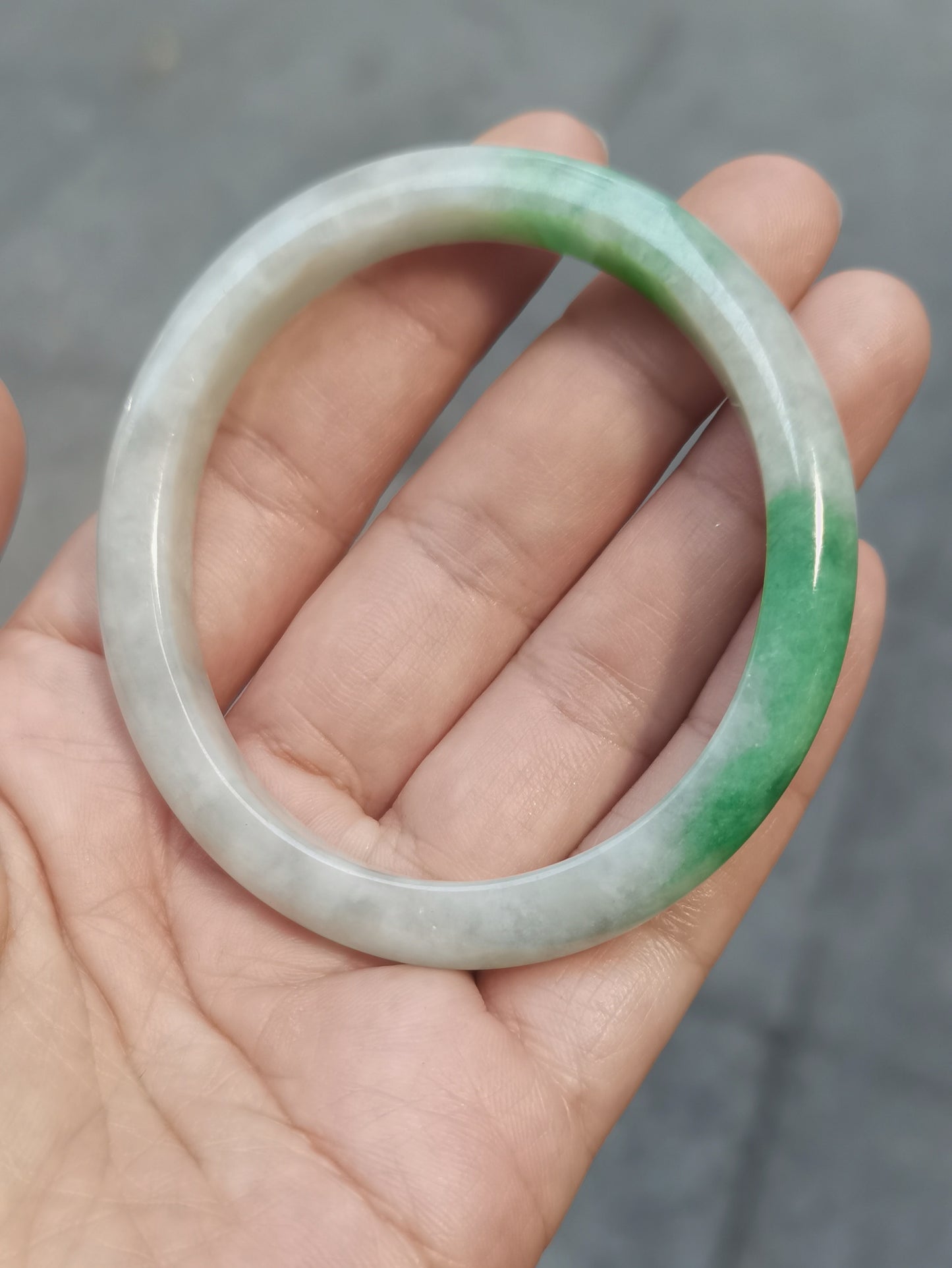 GUARDIAN | JAYDE Untreated Grade-A Jadeite Bangle in Dreamy White with patches of Vibrant Green (56.1mm Oval)