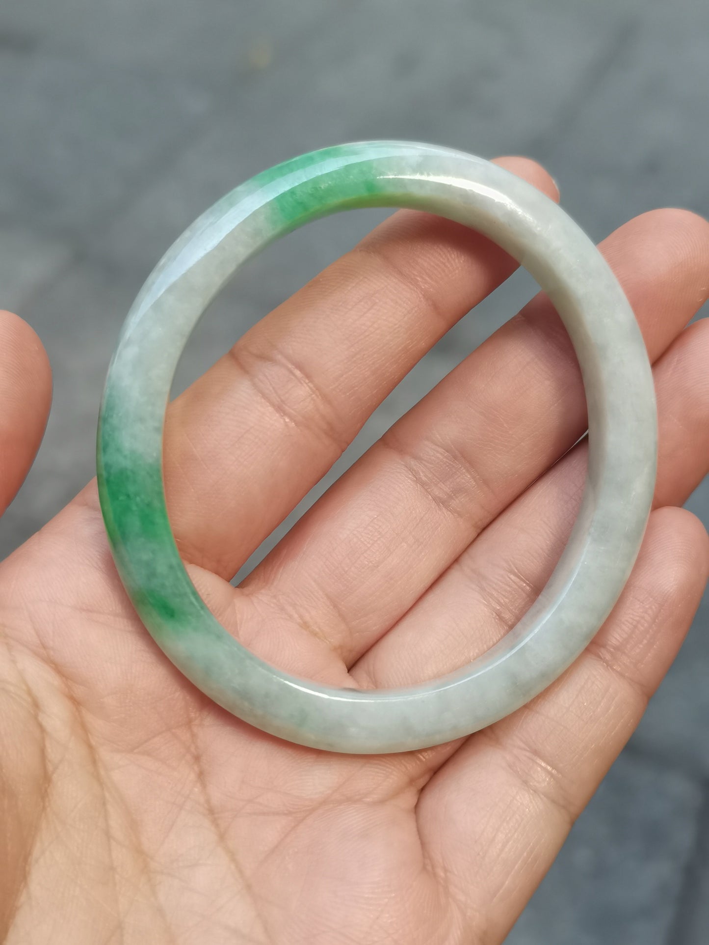 GUARDIAN | JAYDE Untreated Grade-A Jadeite Bangle in Dreamy White with patches of Vibrant Green (56.1mm Oval)