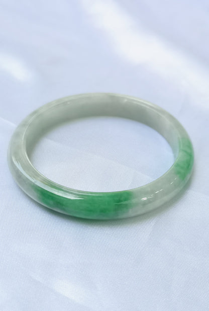 GUARDIAN | JAYDE Untreated Grade-A Jadeite Bangle in Dreamy White with patches of Vibrant Green (56.1mm Oval)