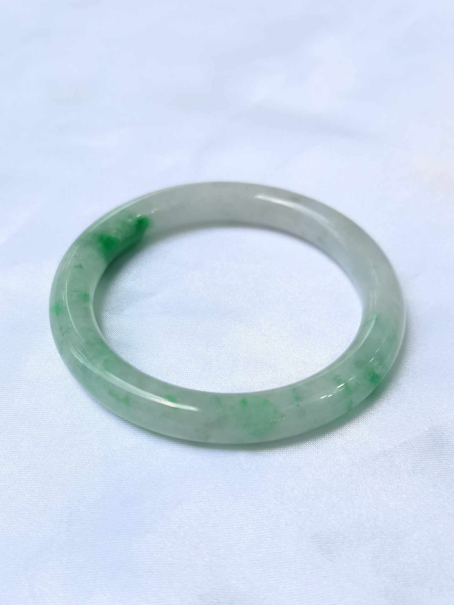 GUARDIAN | JAYDE Untreated Grade-A Jadeite Bangle in Dreamy White with patches of Vibrant Green (54.4mm Round)