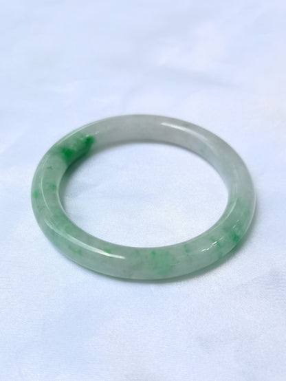 GUARDIAN | JAYDE Untreated Grade-A Jadeite Bangle in Dreamy White with patches of Vibrant Green (54.4mm Round)