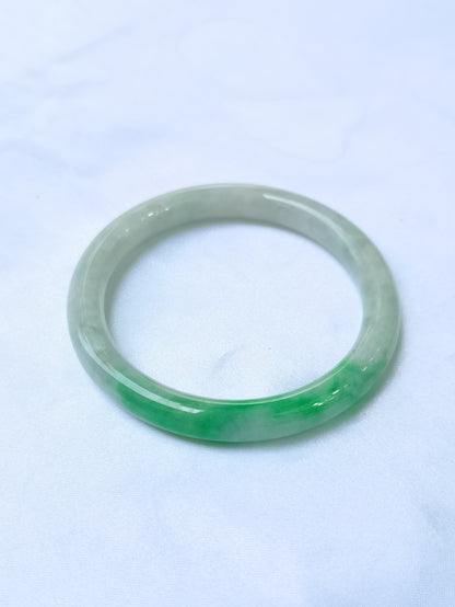 GUARDIAN | JAYDE Untreated Grade-A Jadeite Bangle in Dreamy White with patches of Vibrant Green (53.7mm Round)
