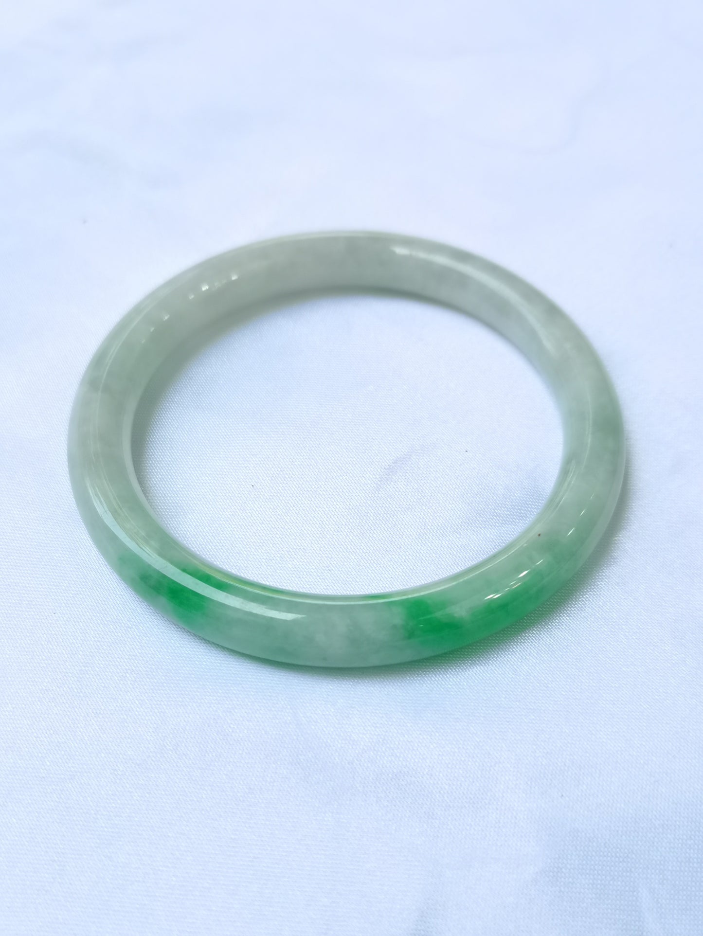 GUARDIAN | JAYDE Untreated Grade-A Jadeite Bangle in Dreamy White with patches of Vibrant Green (53.7mm Round)