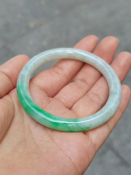 GUARDIAN | JAYDE Untreated Grade-A Jadeite Bangle in Dreamy White with patches of Vibrant Green (53.7mm Round)