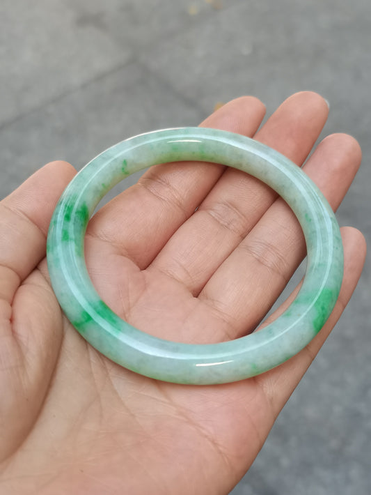 GUARDIAN | JAYDE Untreated Grade-A Jadeite Bangle in Dreamy White with patches of Vibrant Green (56.5mm Round)