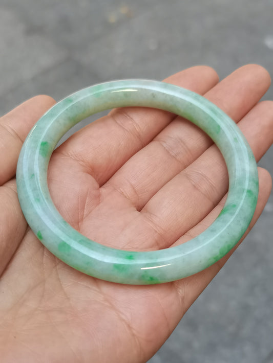GUARDIAN | JAYDE Untreated Grade-A Jadeite Bangle in Dreamy White with patches of Vibrant Green (56.5mm Round)