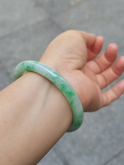 GUARDIAN | JAYDE Untreated Grade-A Jadeite Bangle in Pastel Green with patches of Vibrant Green (55.8mm Round)