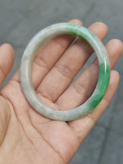 GUARDIAN | JAYDE Untreated Grade-A Jadeite Bangle in Dreamy White with patches of Vibrant Green (56.1mm Oval)